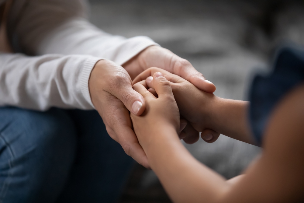 Photo of a Parent Holding Hands
